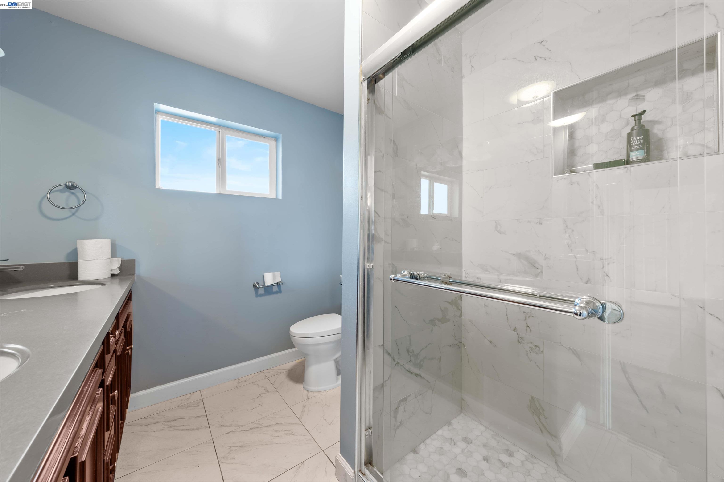 2102 Overhill Road Concord, CA 94520 - Photo 29 of 38 a bathroom with a sink a toilet and a shower