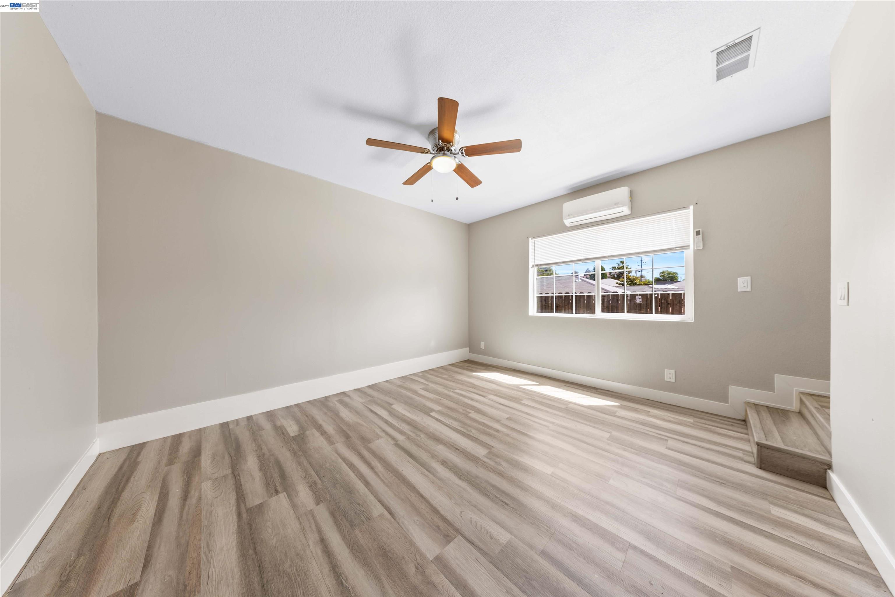 2102 Overhill Road Concord, CA 94520 - Photo 30 of 38 wooden floor in an empty room with a window