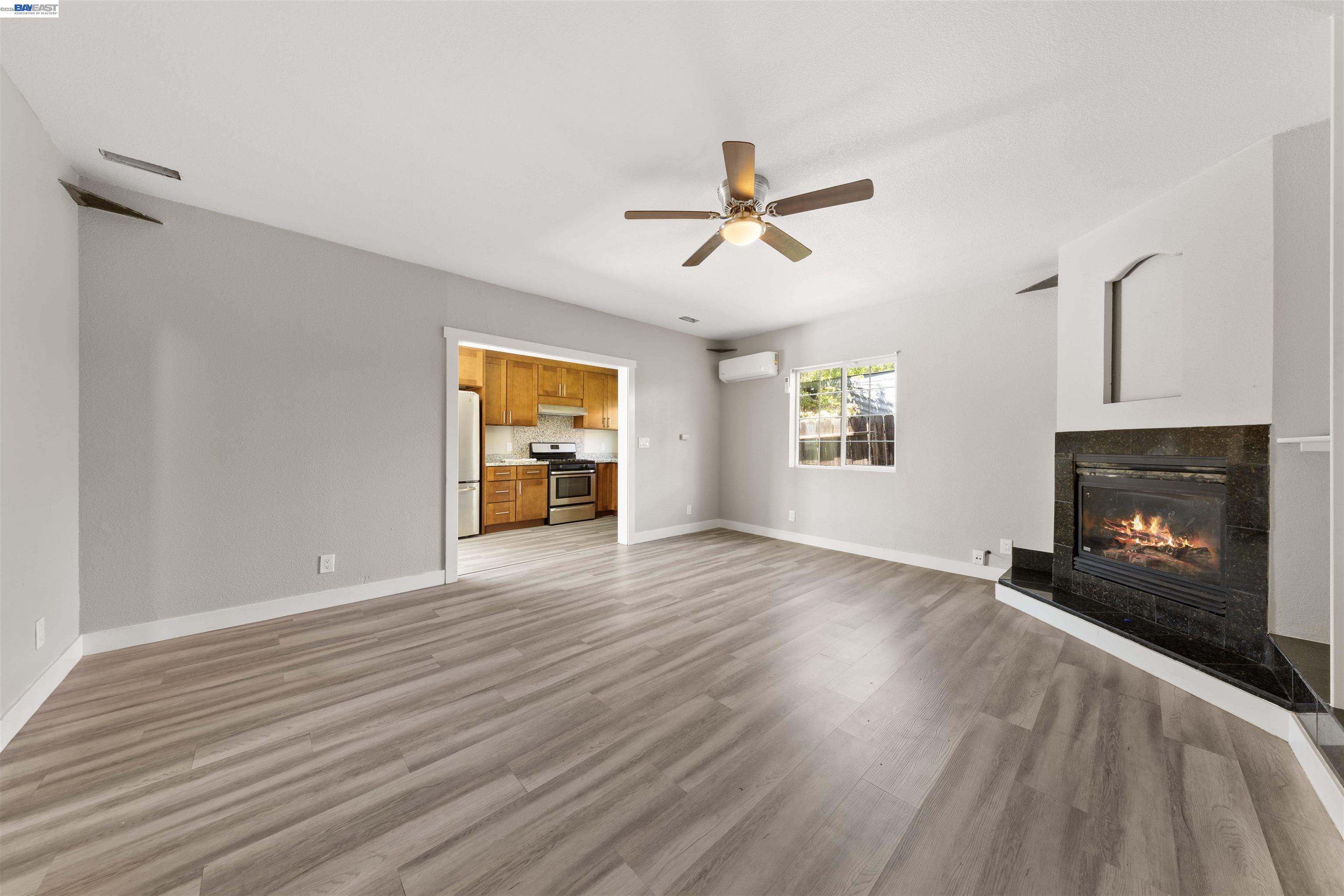 2102 Overhill Road Concord, CA 94520 - Photo 35 of 38 a view of empty room with wooden floor and fireplace