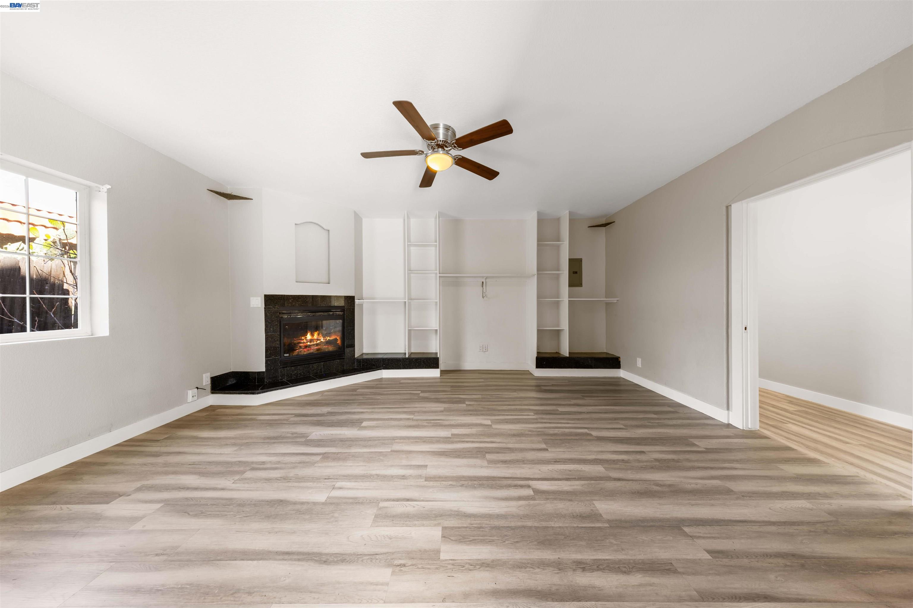 2102 Overhill Road Concord, CA 94520 - Photo 36 of 38 a view of an empty room with a fireplace and a window