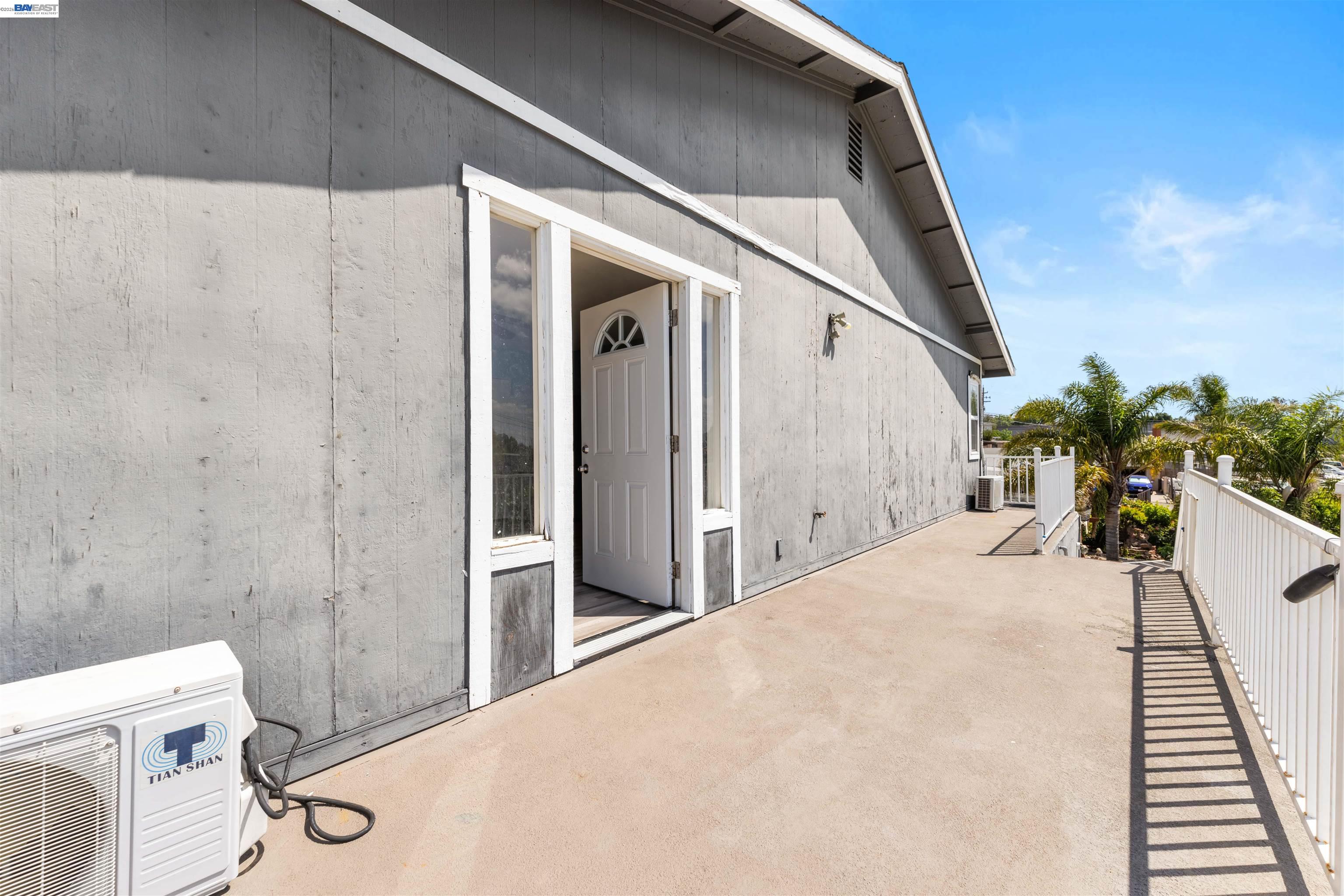 2102 Overhill Road Concord, CA 94520 - Photo 4 of 38 a view of a hallway with paintings on the wall