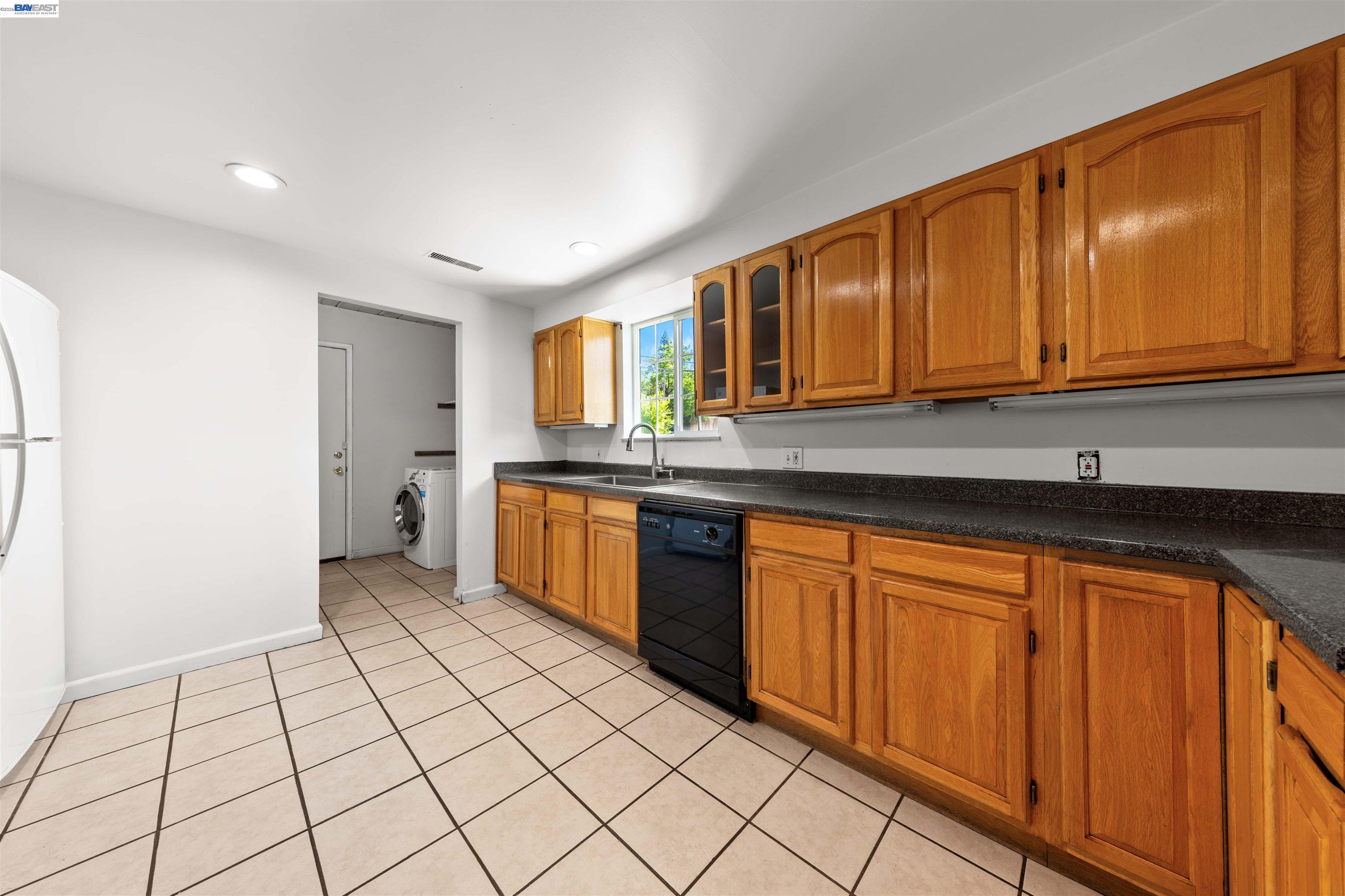 2102 Overhill Road Concord, CA 94520 - Photo 8 of 38 a kitchen with stainless steel appliances granite countertop a sink stove and cabinets