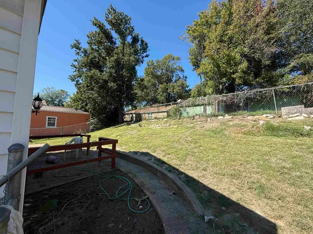 a view of a swimming pool with a yard