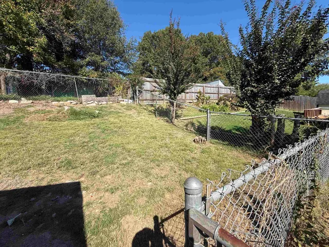 a view of a yard with an outdoor space