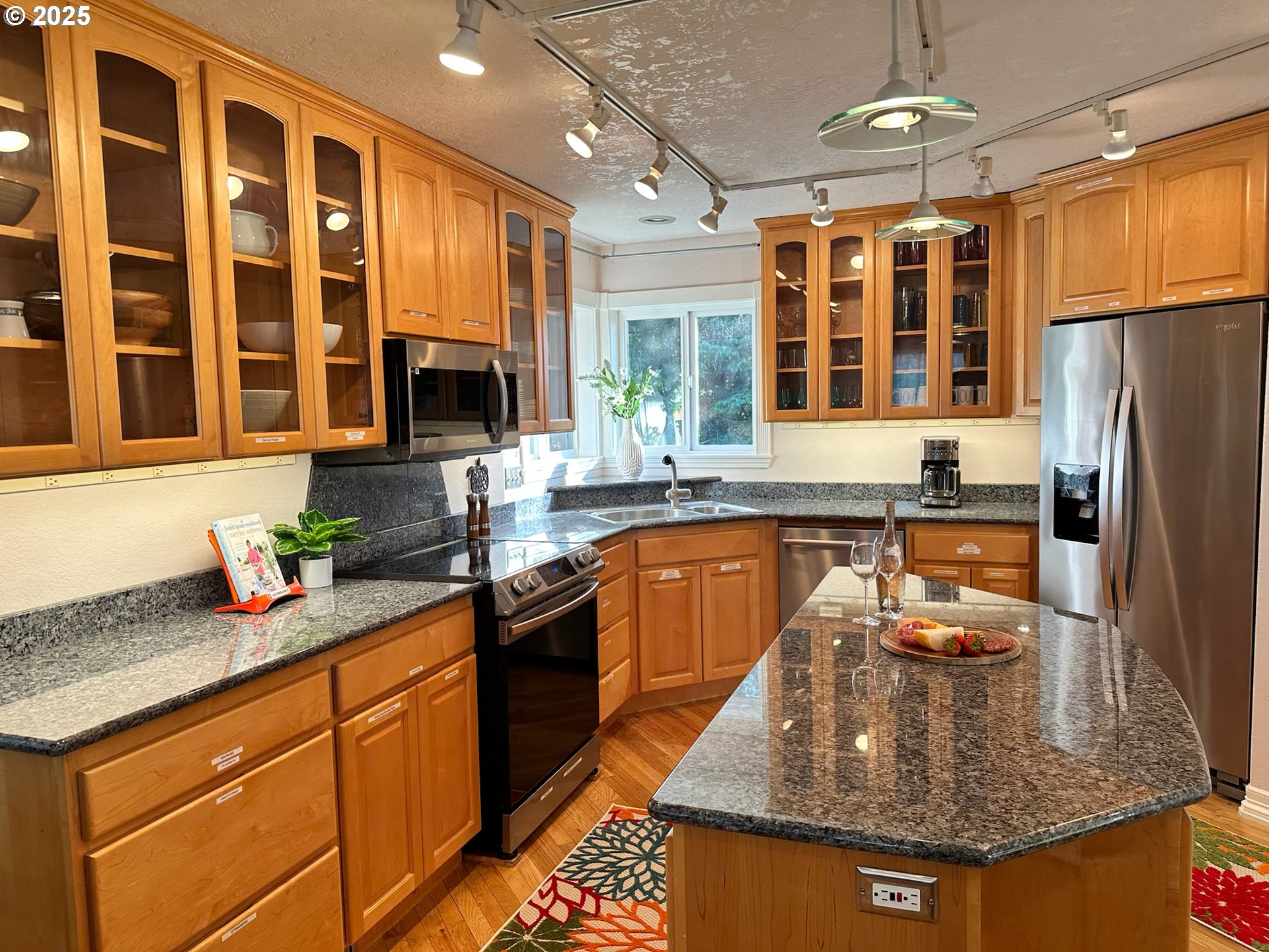 35445 Topping Road Pacific City, OR 97135 - Photo 13 of 37 a kitchen with stainless steel appliances granite countertop a sink stove and refrigerator