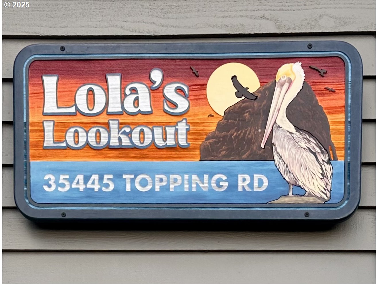 35445 Topping Road Pacific City, OR 97135 - Photo 2 of 37 a sign that is on the side of a building