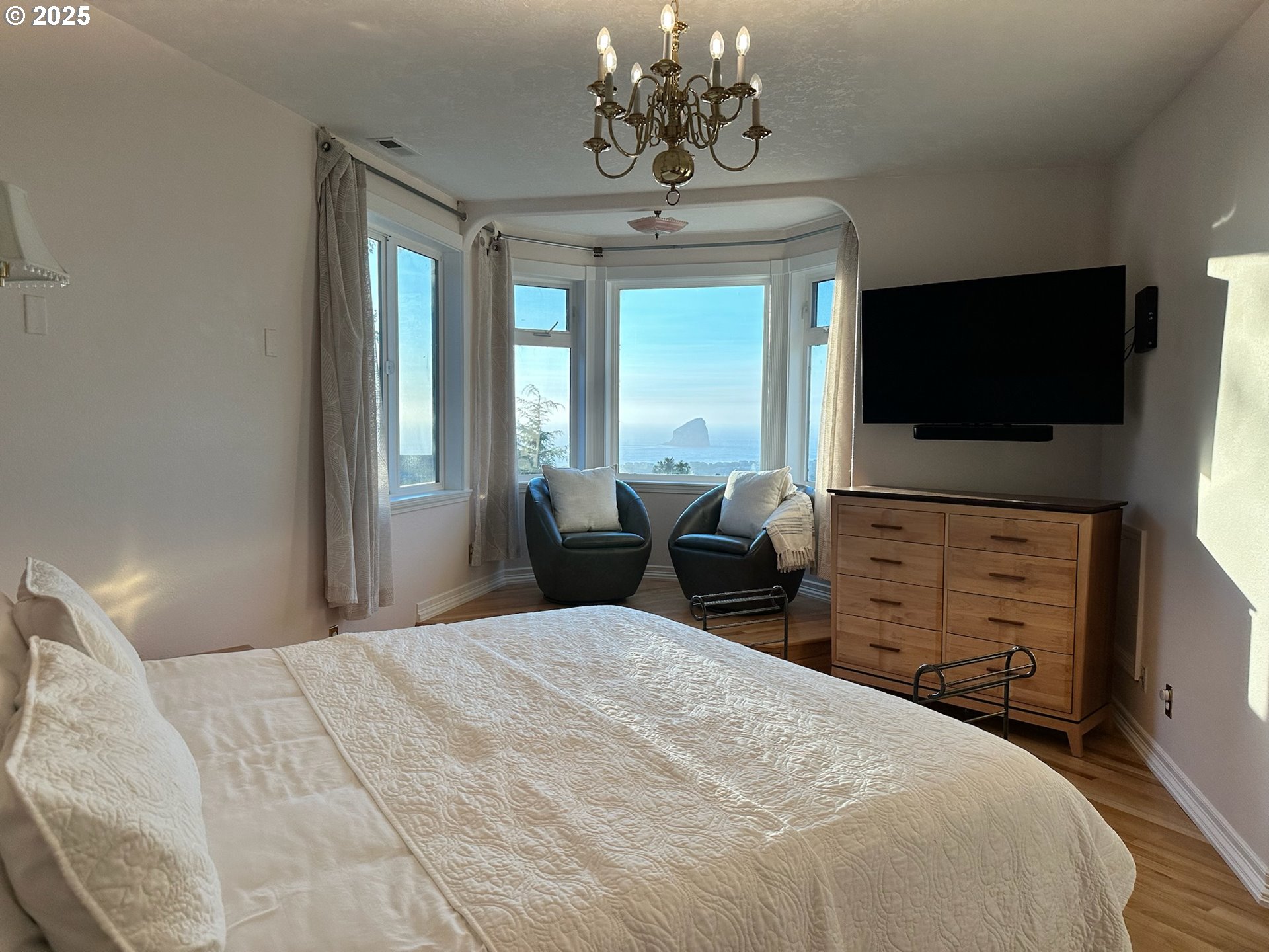 35445 Topping Road Pacific City, OR 97135 - Photo 21 of 37 a bedroom with a bed and a flat screen tv