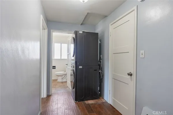 a view of bathroom with a toilet a sink and a mirror