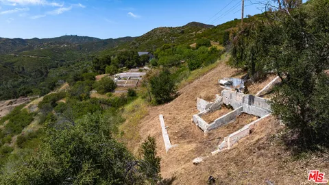 an aerial view of residential house with parking space