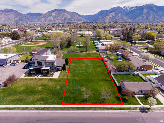 830 North 200 West Logan, UT 84321 - Photo 3 of 7 Aerial view of residential area featuring property boundaries highlighted and mountains