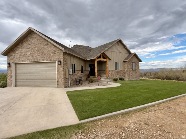 2101 Goose Ranch Road Vernal, UT 84078 - Photo 2 of 72 *Photo digitally enhanced* Lawn color shown is for illustrative purposes. Full sprinkler system and currently heat stressed lawn is present, see photo #60