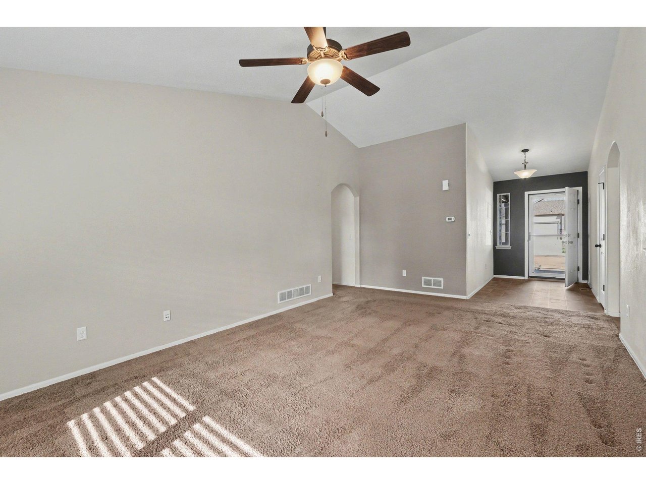 7347 Atlantis Street Wellington, CO 80549 - Photo 8 of 23 View from living room to front door