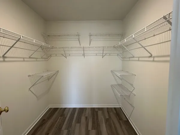 a view of storage and utility room with racks on the wall