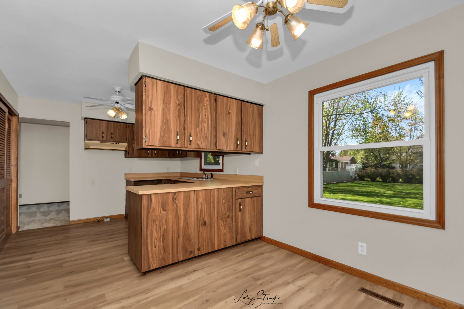 869 Heather Drive Bourbonnais, IL 60914 - Photo 13 of 23 a kitchen with stainless steel appliances granite countertop a stove and a wooden floors