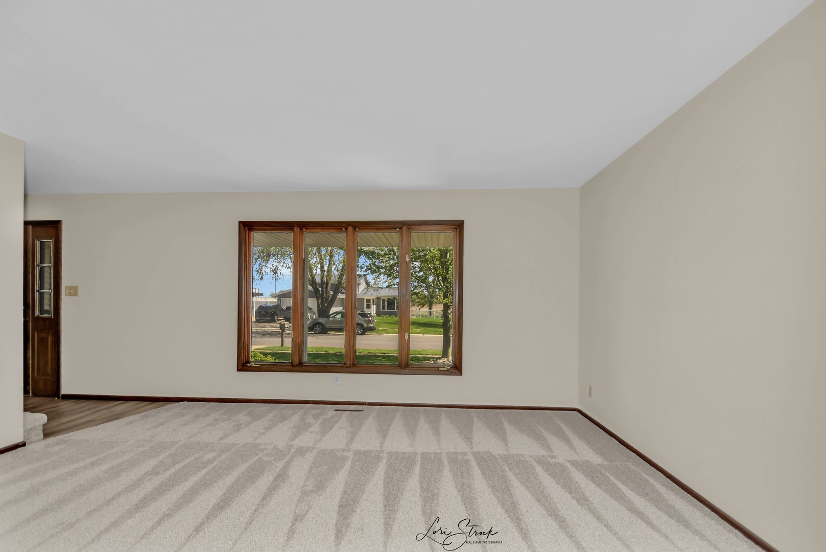 869 Heather Drive Bourbonnais, IL 60914 - Photo 16 of 23 wooden floor in an empty room with a window