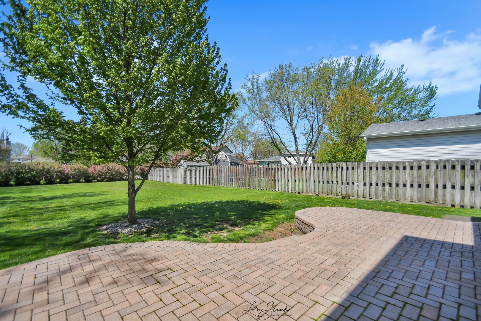 869 Heather Drive Bourbonnais, IL 60914 - Photo 4 of 23 a view of a street with a wooden fence