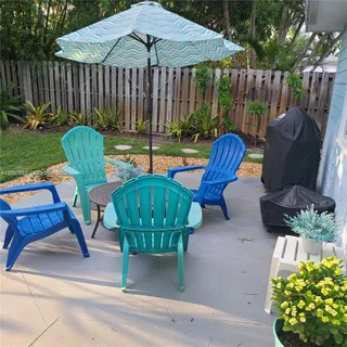 a view of a chairs in patio