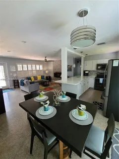 a view of a dining room with furniture