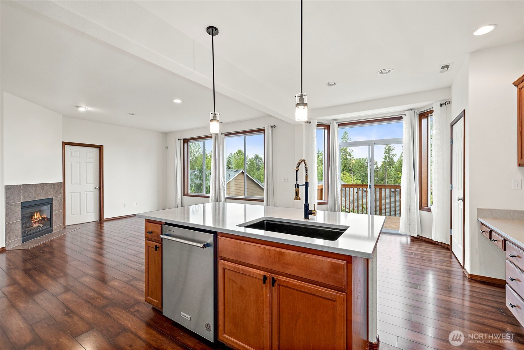 22820 41st Drive Southeast Bothell, WA 98021 - Photo 15 of 38 a kitchen with stainless steel appliances granite countertop a sink a stove and a wooden floor