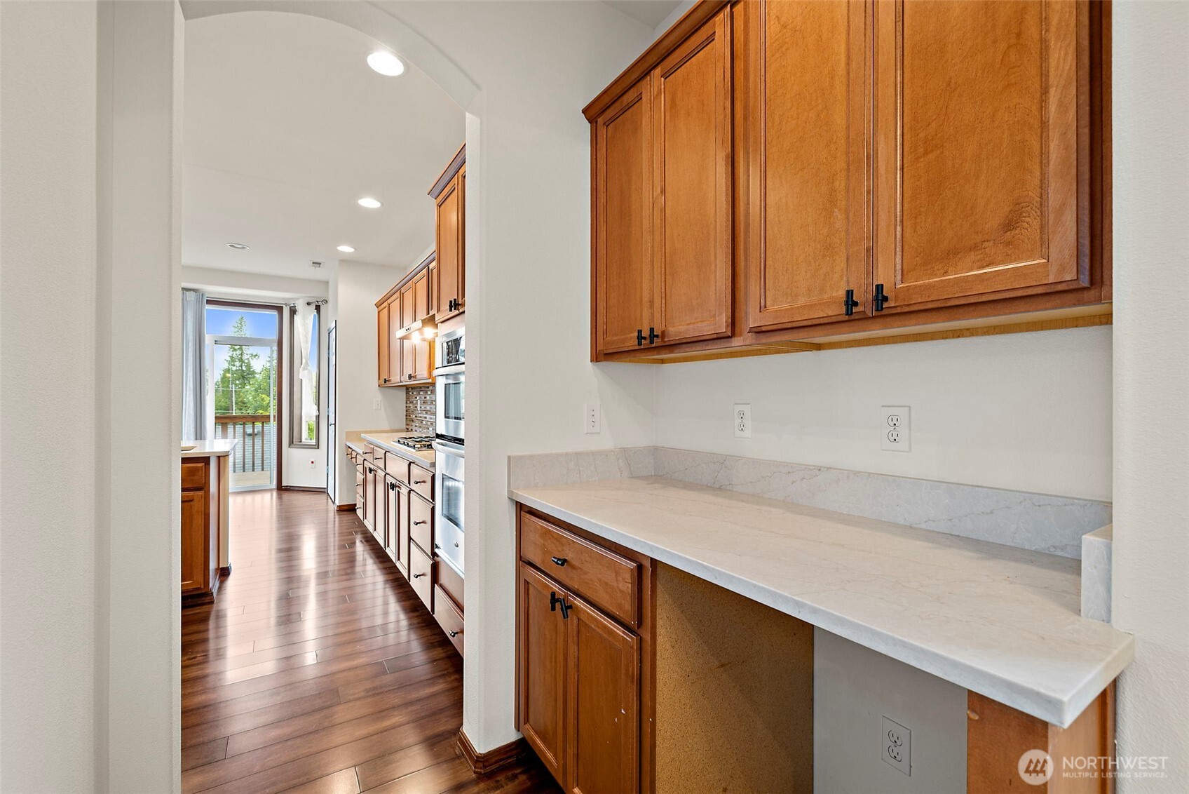 22820 41st Drive Southeast Bothell, WA 98021 - Photo 16 of 38 a hallway view with wooden floor and staircase