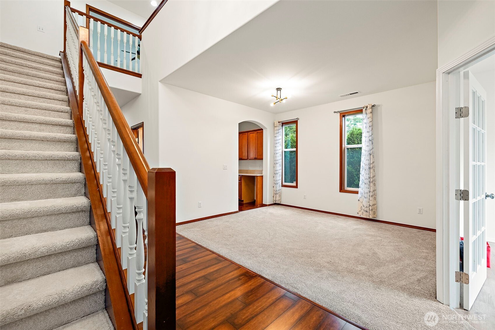 22820 41st Drive Southeast Bothell, WA 98021 - Photo 4 of 38 a view of an empty room with wooden floor and stairs