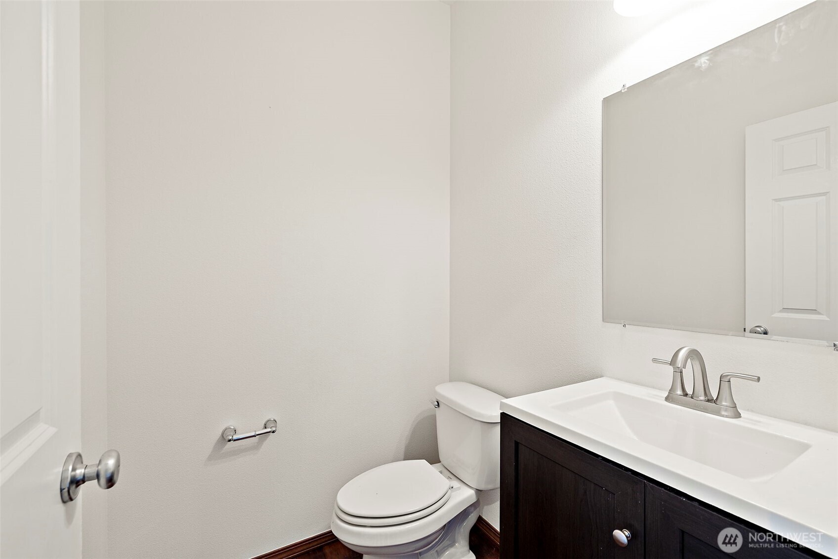 22820 41st Drive Southeast Bothell, WA 98021 - Photo 7 of 38 a bathroom with a granite countertop toilet sink mirror and vanity