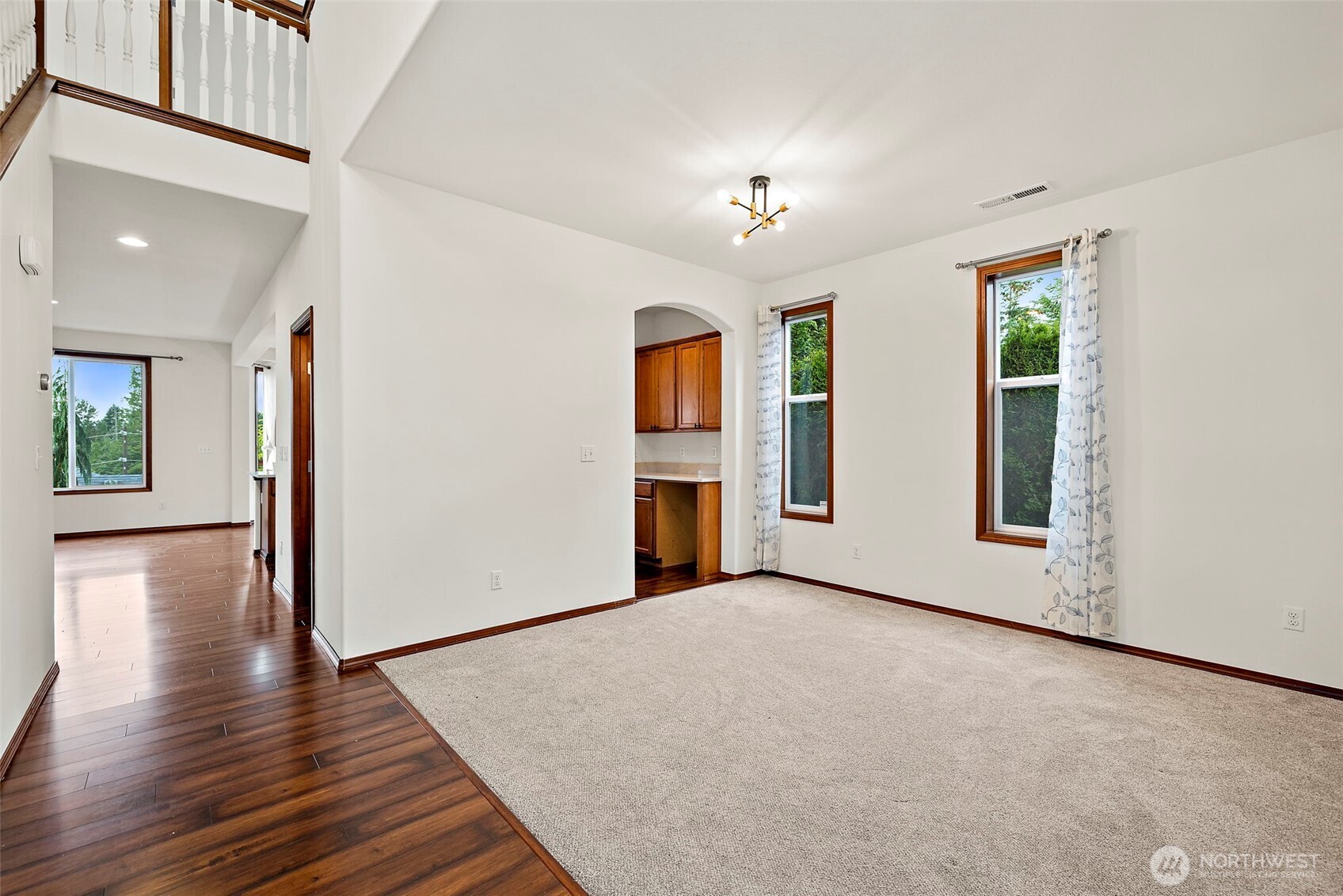 22820 41st Drive Southeast Bothell, WA 98021 - Photo 8 of 38 a view of an empty room with wooden floor and a window
