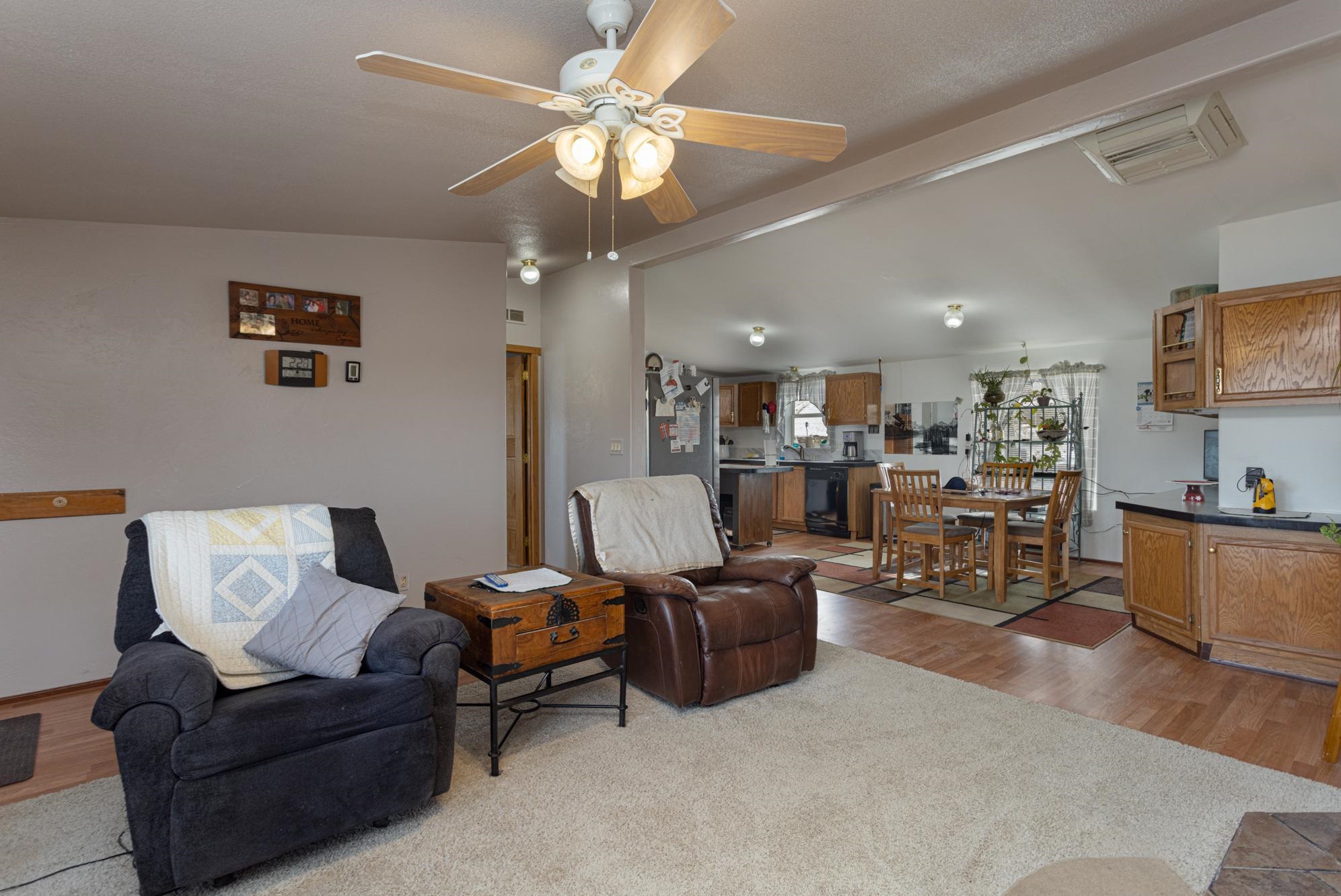 1546 10 Road Mack, CO 81525 - Photo 10 of 34 a living room with furniture and a flat screen tv