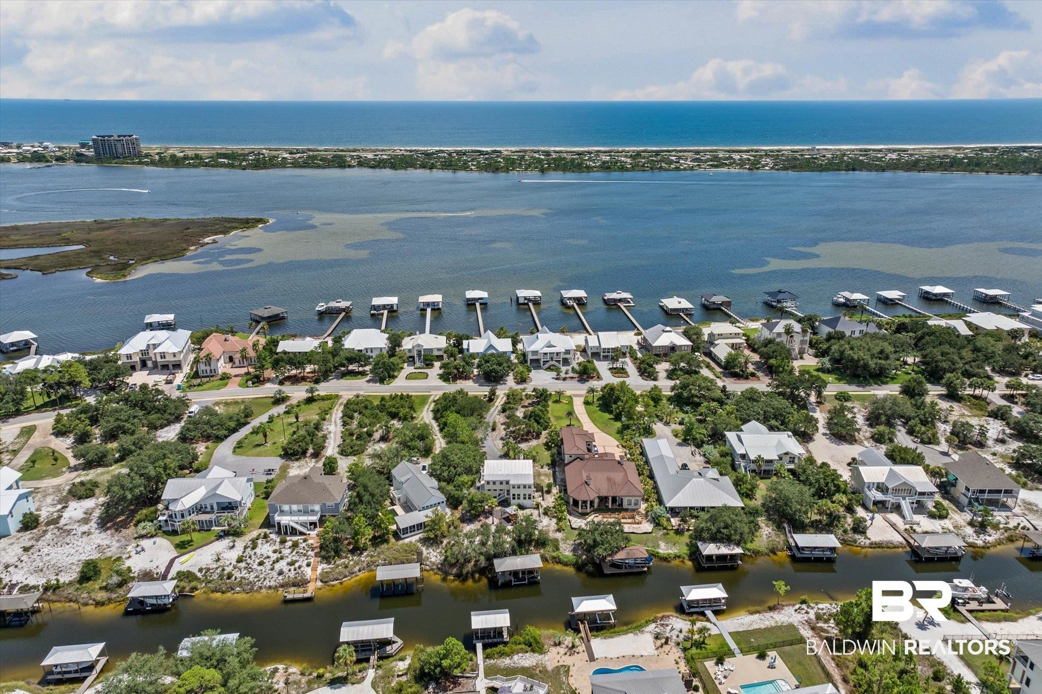 33129 River Road Orange Beach, AL 36561 - Photo 23 of 34 Aerial view of residential area with a nearby body of water