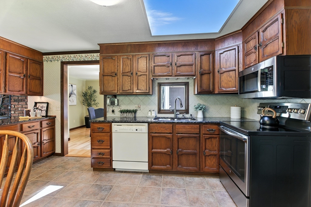 134 Chester Road Blandford, MA 01008 - Photo 13 of 41 a kitchen with stainless steel appliances granite countertop a stove top oven a sink dishwasher and a refrigerator