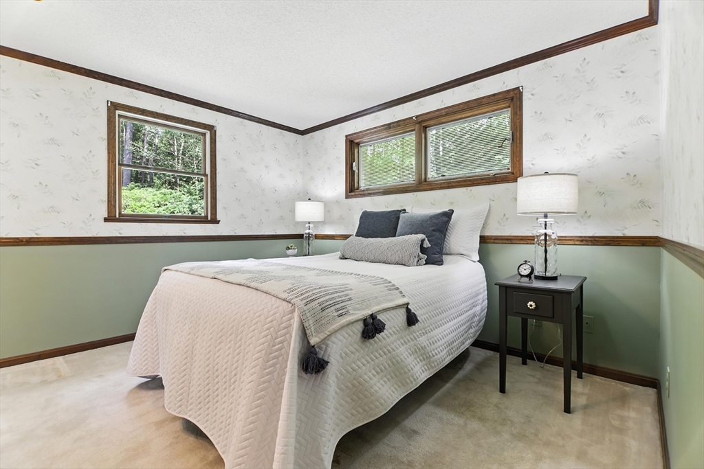 134 Chester Road Blandford, MA 01008 - Photo 19 of 41 a bedroom with a bed and a painting on the wall