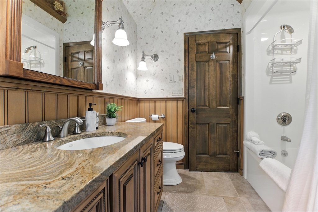 134 Chester Road Blandford, MA 01008 - Photo 23 of 41 a bathroom with a granite countertop sink and a mirror