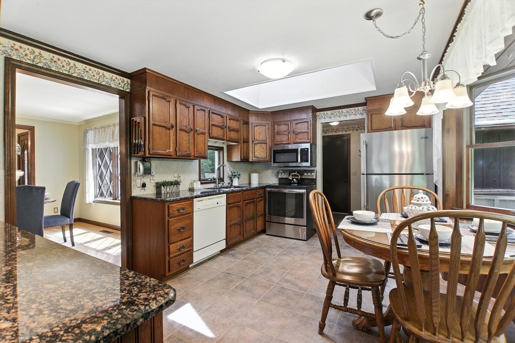134 Chester Road Blandford, MA 01008 - Photo 3 of 41 a kitchen with a dining table chairs and refrigerator