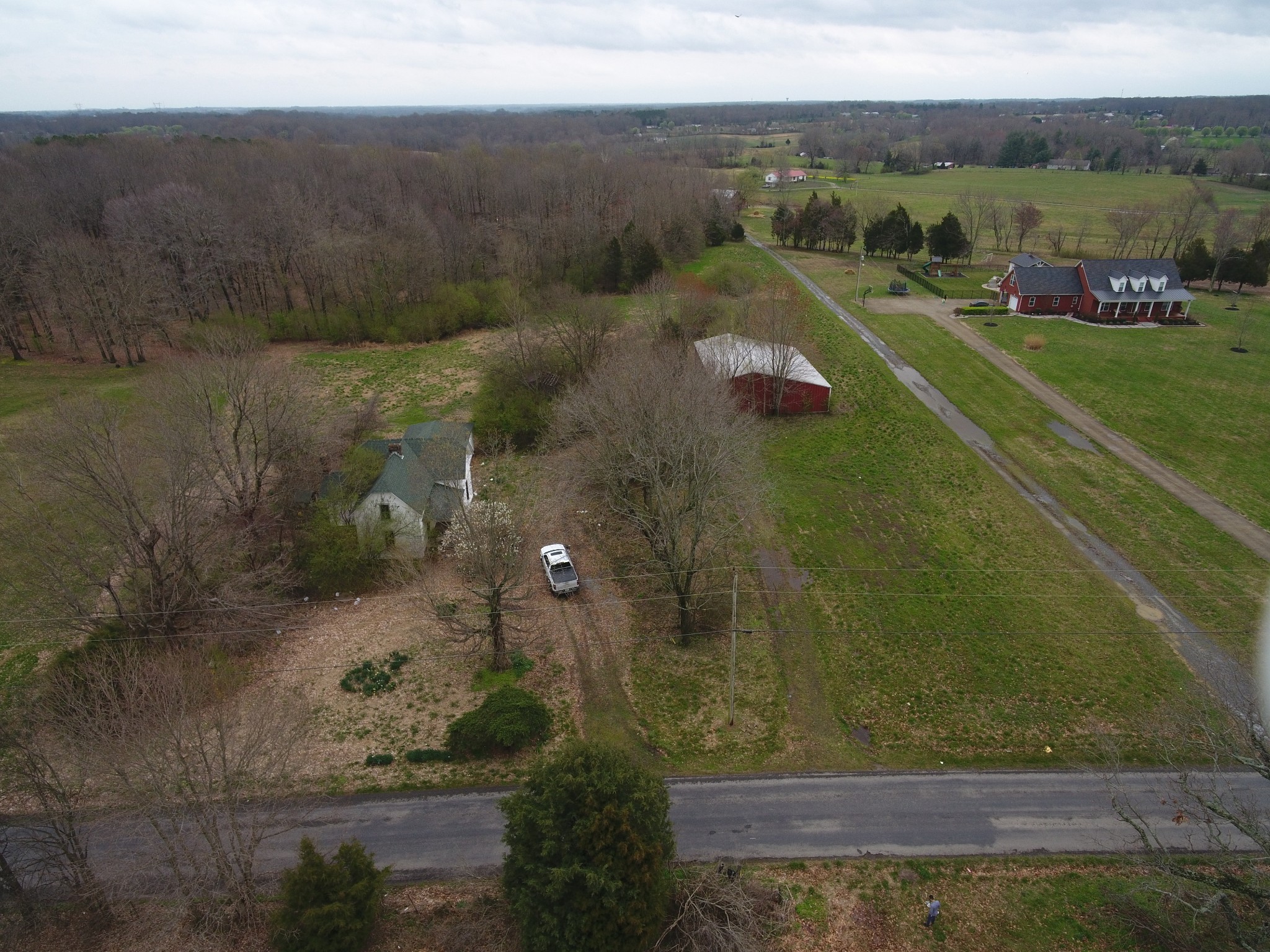 an aerial view of a houses with a yard