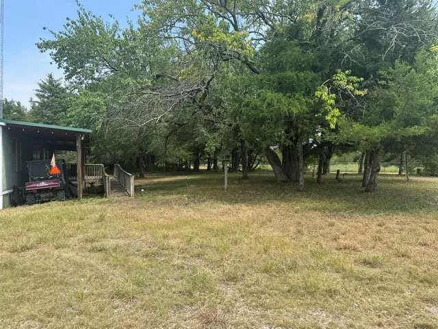 a view of balcony with wooden floor