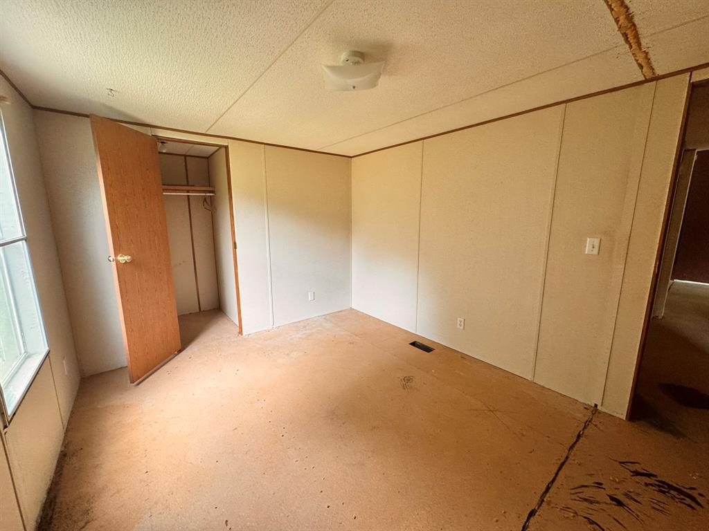 1980 County Road 3040 Bonham, TX 75418 - Photo 13 of 34 a view of empty room with windows