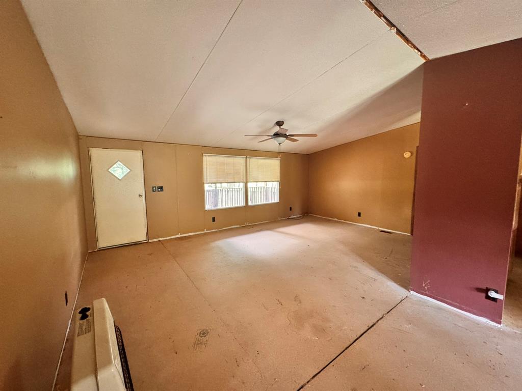 1980 County Road 3040 Bonham, TX 75418 - Photo 14 of 34 a view of an empty room with a window