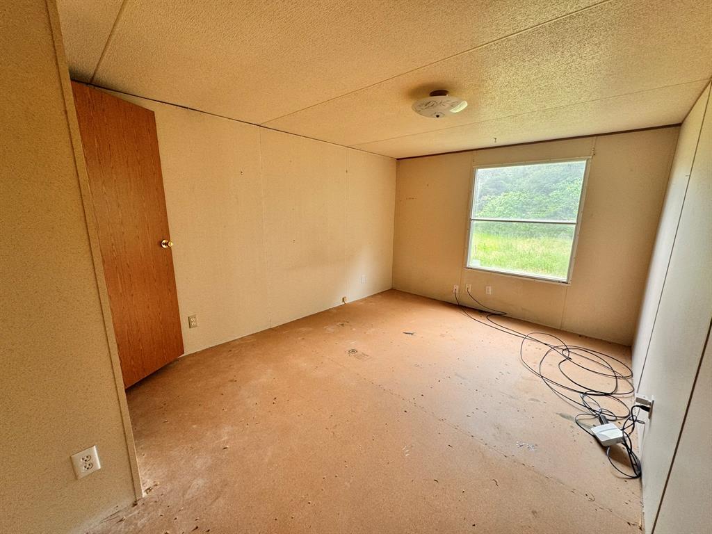 1980 County Road 3040 Bonham, TX 75418 - Photo 16 of 34 a view of an empty room with a window