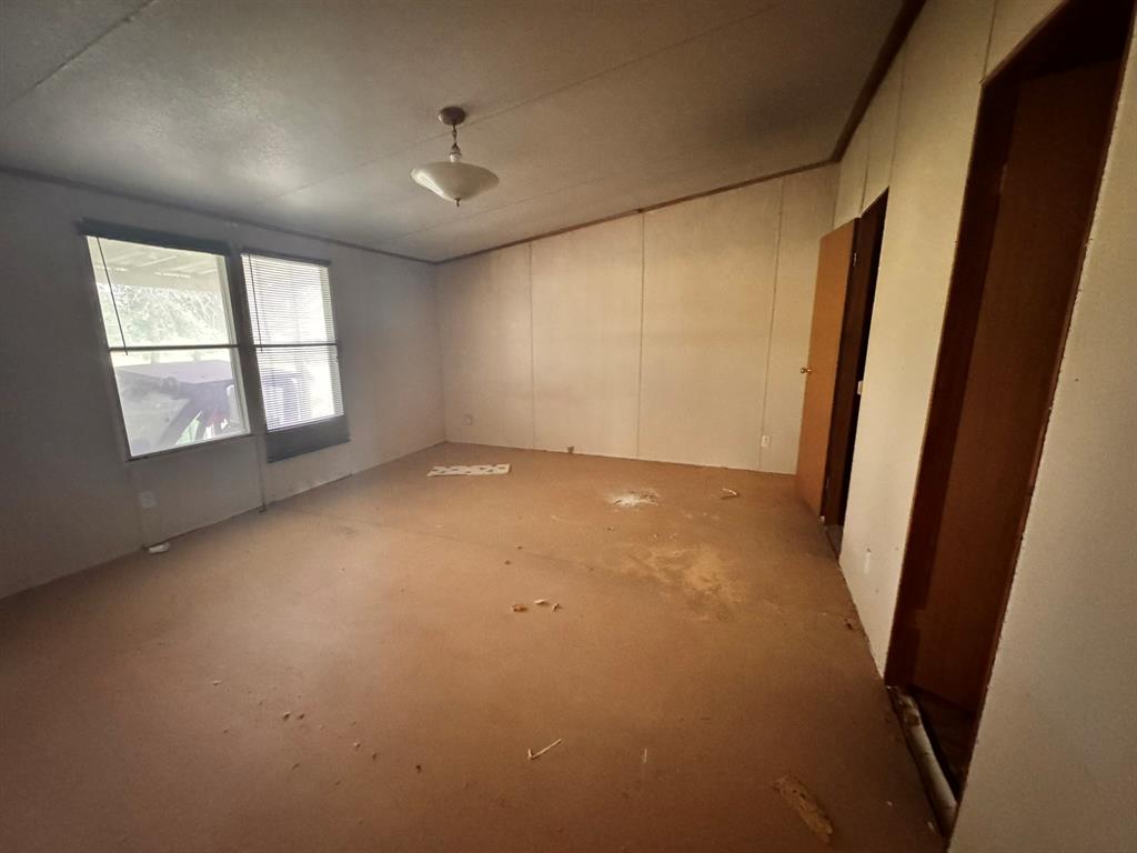 1980 County Road 3040 Bonham, TX 75418 - Photo 17 of 34 an empty room with windows and closet
