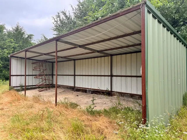 a view of outdoor space with playground and green space