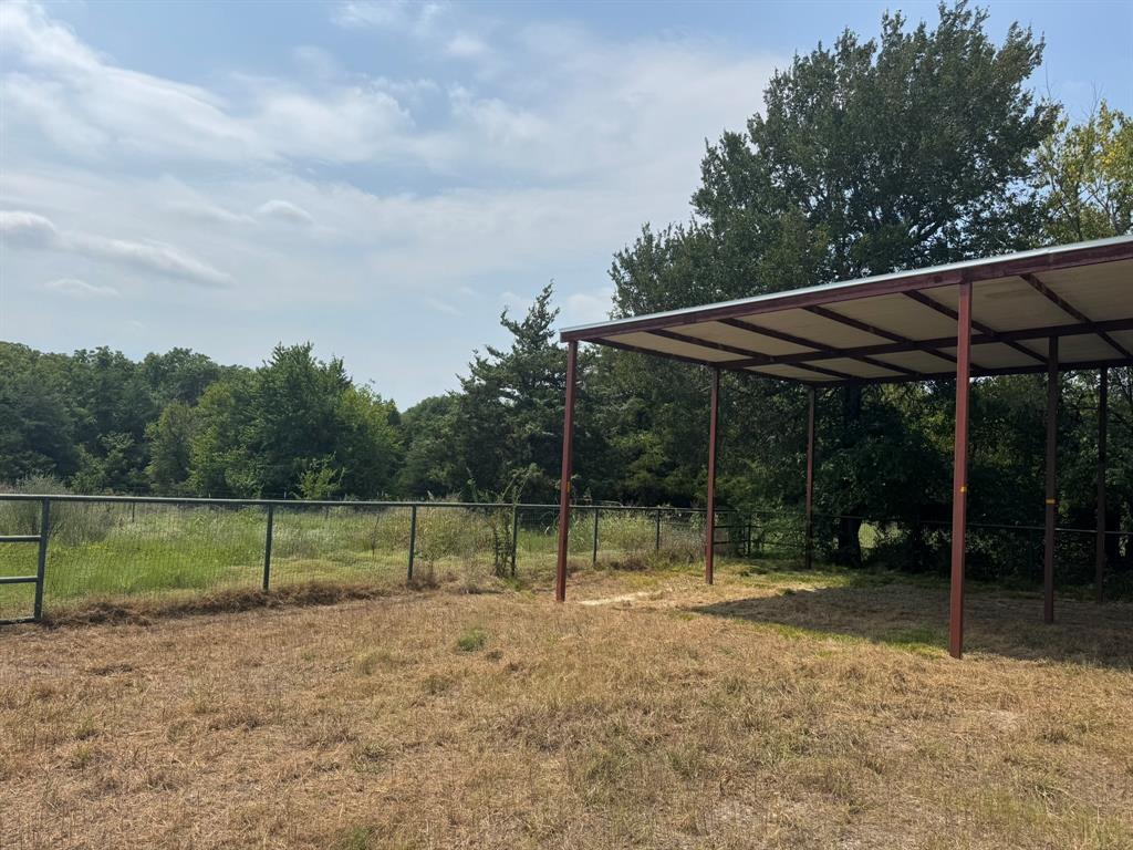1980 County Road 3040 Bonham, TX 75418 - Photo 19 of 34 a view of outdoor space with playground and green space