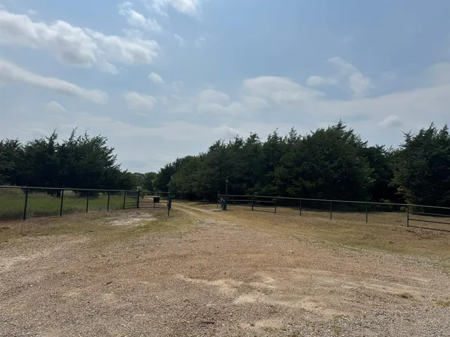 a view of swimming pool with a yard in the back