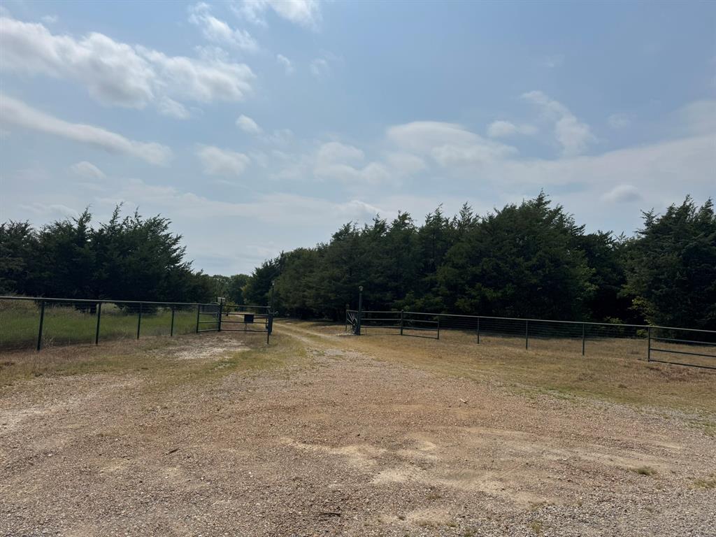 1980 County Road 3040 Bonham, TX 75418 - Photo 2 of 34 a view of swimming pool with a yard in the back