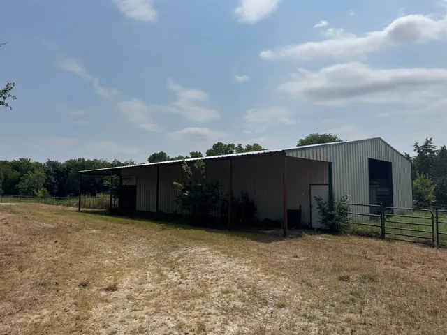 a bathroom with a shower curtain and sink