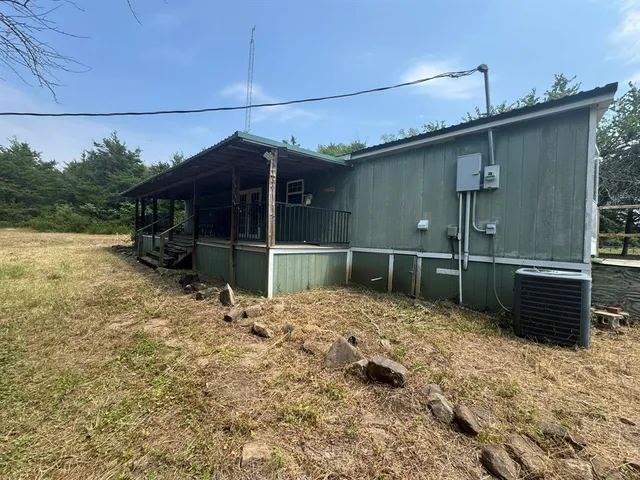 a view of outdoor space with deck and yard