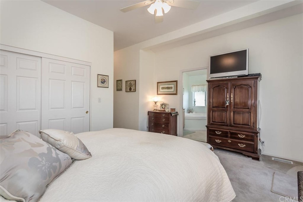 352 Quail Summit Paso Robles, CA 93446 - Photo 16 of 33 a bedroom with a bed and a tv on dresser