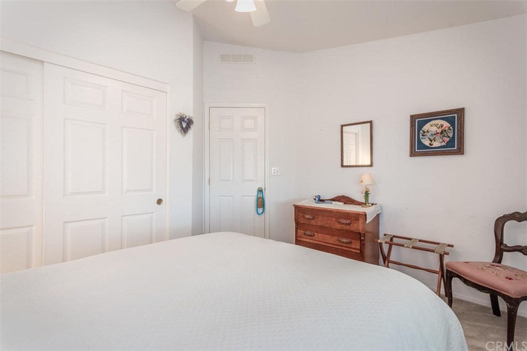 352 Quail Summit Paso Robles, CA 93446 - Photo 20 of 33 a bedroom with a bed and a table in it