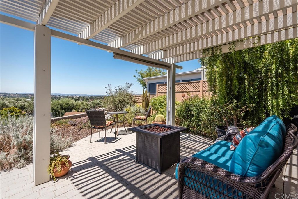 352 Quail Summit Paso Robles, CA 93446 - Photo 25 of 33 a view of a patio with couches table and chairs and potted plants