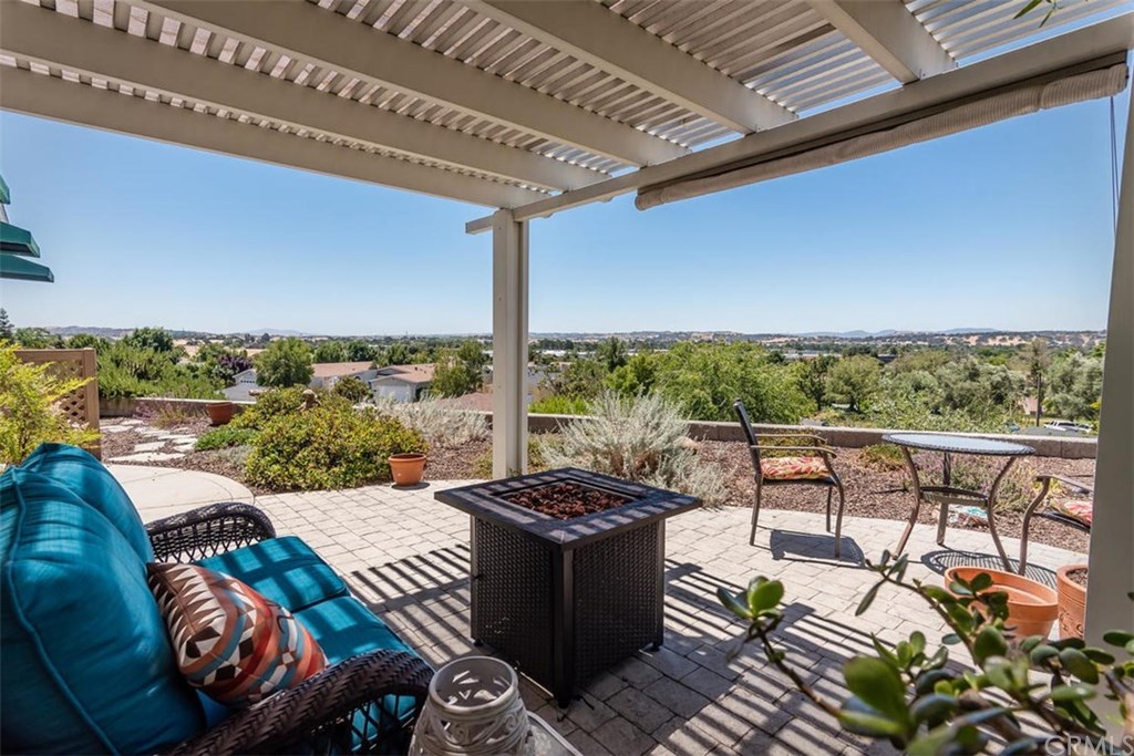 352 Quail Summit Paso Robles, CA 93446 - Photo 26 of 33 a view of a balcony with furniture and a floor to ceiling window