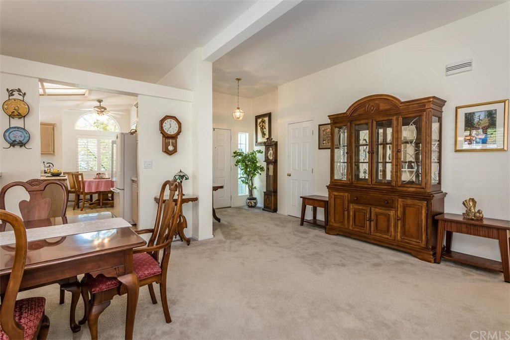 352 Quail Summit Paso Robles, CA 93446 - Photo 7 of 33 a living room with furniture a window and a flat screen tv